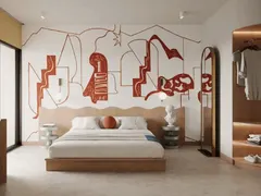 Suite King Duplex con cama King bajo un mural de líneas rojas y clóset abierto